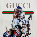 Flat lay presentation of Gucci luxury clothing with signature branding
