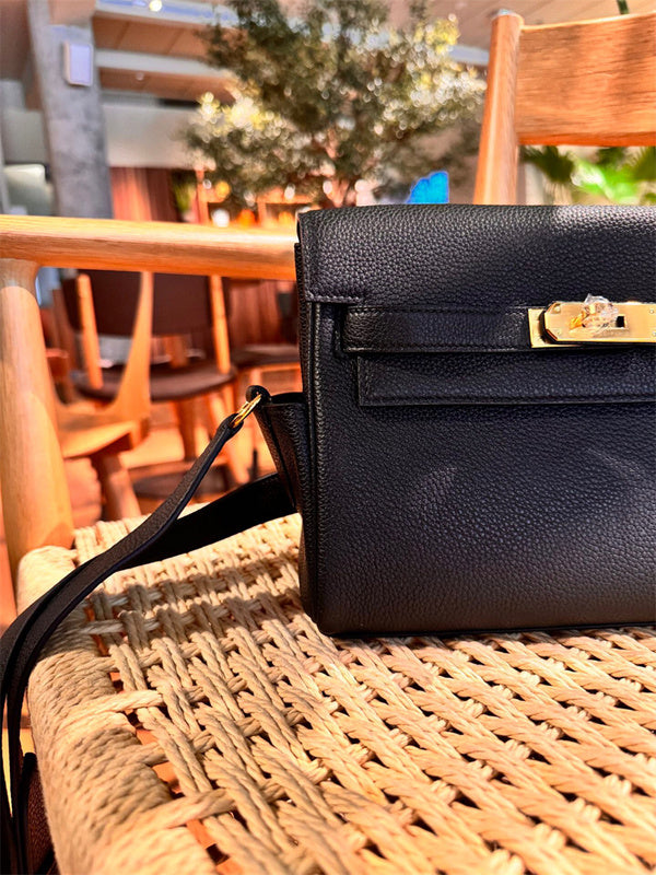 Side view of polished structured handbag