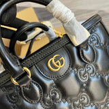Back view of signature polished women's handbag – women's luxury handbag