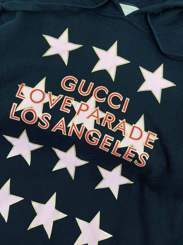 Close-up detail shot of Gucci luxury clothing with logo-detail design