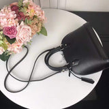 Close-up detail of classic signature women's handbag – women's luxury handbag
