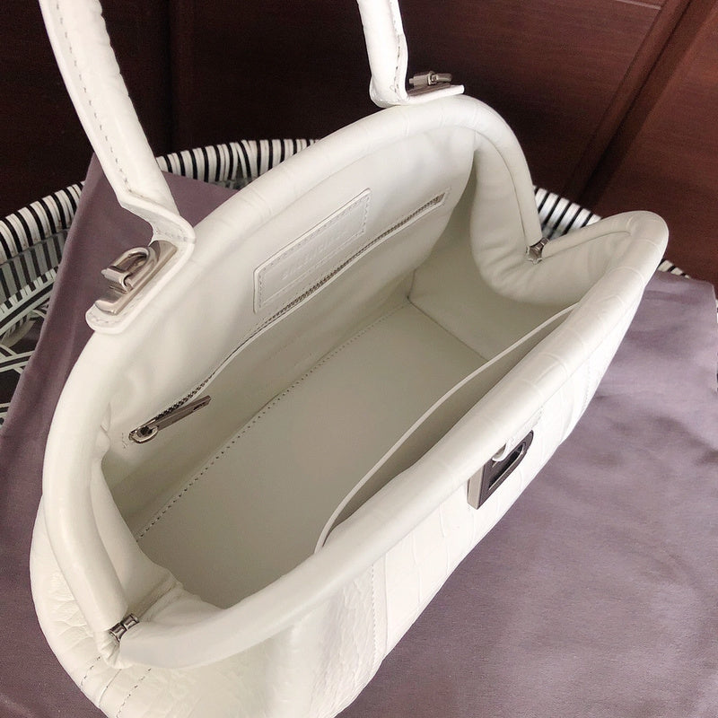 Top view of elevated modern women's handbag – women's statement bag