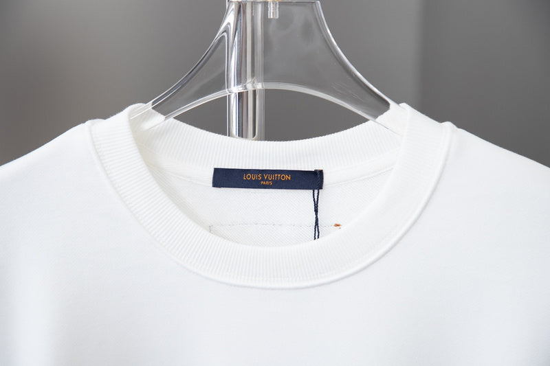 Close-up detail shot of Louis Vuitton luxury clothing with runway-inspired design