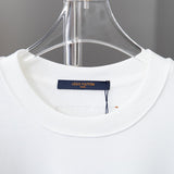 Close-up detail shot of Louis Vuitton luxury clothing with runway-inspired design