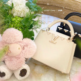  Sleek structured bag carried on shoulder 28