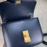 Styled lifestyle shot of sleek elevated women's handbag – women's luxury handbag