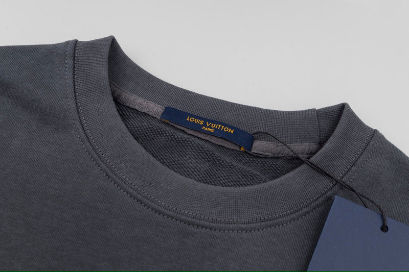 Close-up detail shot of Louis Vuitton luxury clothing with contemporary cut