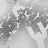 Close-up detail shot of Louis Vuitton luxury clothing with monogram-inspired silhouette