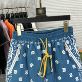 Close-up detail shot of Rhude luxury clothing with runway-inspired design