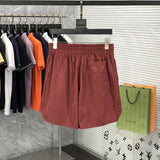 Flat lay presentation of Rhude luxury clothing with runway-inspired design