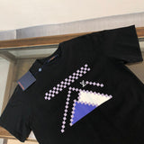 Close-up detail shot of Louis Vuitton cotton t-shirt with runway-inspired design