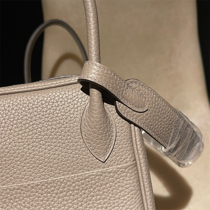 Side view of tailored structured handbag