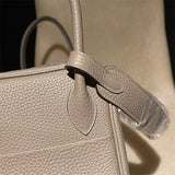 Side view of tailored structured handbag