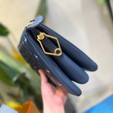 Handle and strap detail of structured signature women's handbag – women's statement bag