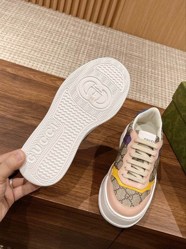 Side profile of Gucci neutral cream sneakers signature lace-up style