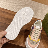 Side profile of Gucci neutral cream sneakers signature lace-up style