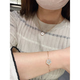 Lifestyle view of Van Cleef & Arpels unisex jewelry piece