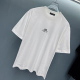 Flat lay presentation of Gucci luxury clothing with monogram-inspired silhouette