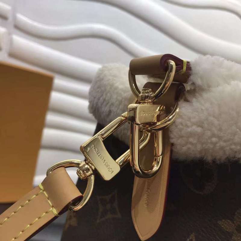 Handle and strap detail of modern signature women's handbag – women's luxury accessory