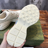 Side profile of Gucci bold contrast sneakers signature lace-up style