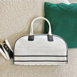 Close-up detail of modern polished women's handbag – women's luxury handbag