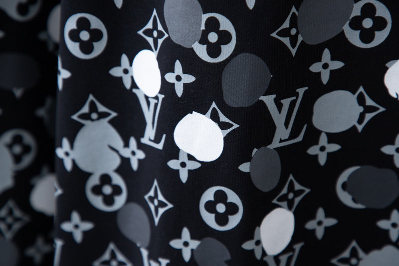 Flat lay presentation of Louis Vuitton luxury clothing with streetwear-inspired cut