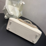  Tailored shoulder bag carried on shoulder