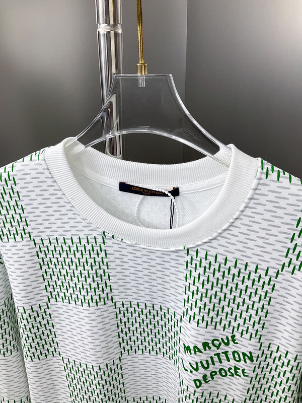 Close-up detail shot of Louis Vuitton luxury clothing with label-forward styling