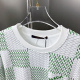 Close-up detail shot of Louis Vuitton luxury clothing with label-forward styling