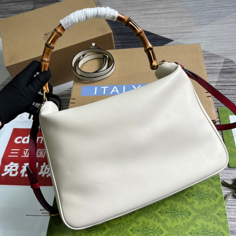 Handle and strap detail of statement everyday-luxe women's handbag – women's luxury accessory