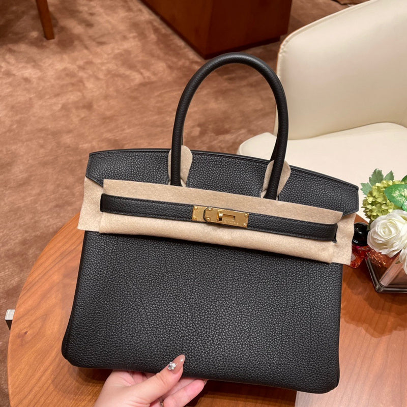 Side view of timeless structured handbag