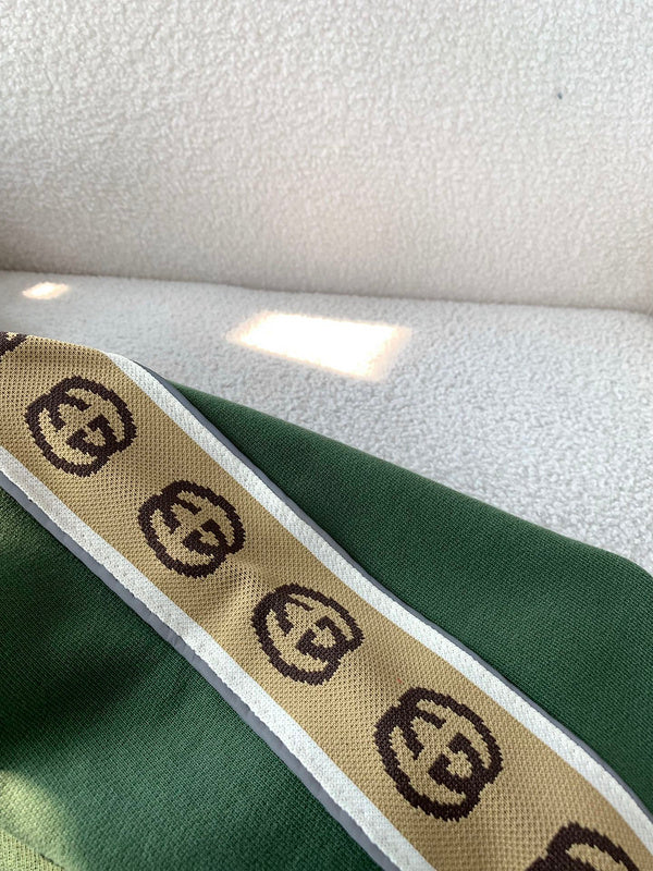 Side profile of Gucci luxury clothing with logo-detail design