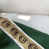 Side profile of Gucci luxury clothing with logo-detail design