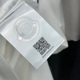 Side profile of Moncler luxury clothing with relaxed-fit cut