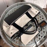 Styled lifestyle shot of modern everyday-luxe women's handbag – women's statement bag