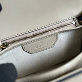Side view of statement structured handbag