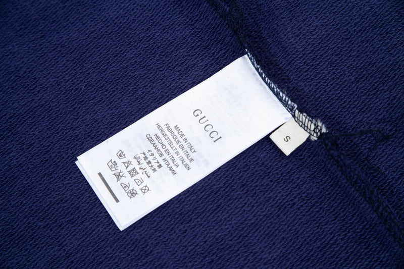 Close-up detail shot of Gucci luxury clothing with everyday silhouette