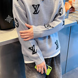 Close-up detail shot of Louis Vuitton luxury clothing with monogram-inspired silhouette