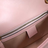 Side profile of polished signature women's handbag – women's statement bag