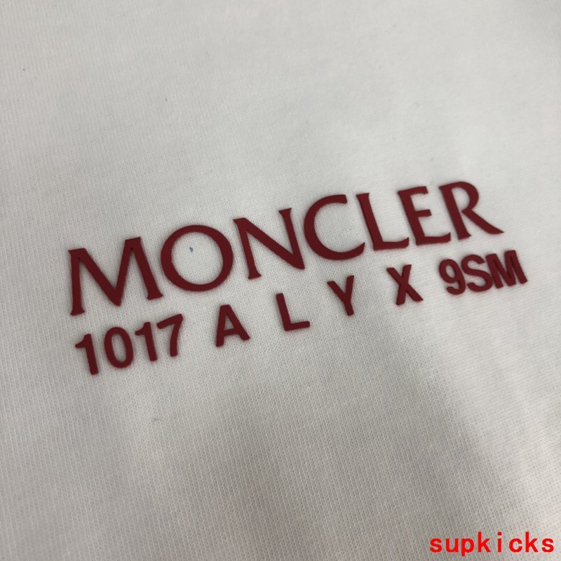 Flat lay presentation of Moncler luxury clothing with everyday silhouette
