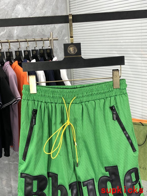 Close-up detail shot of Rhude luxury clothing with monogram-inspired silhouette