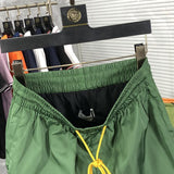 Back view of Rhude luxury clothing with label-forward styling
