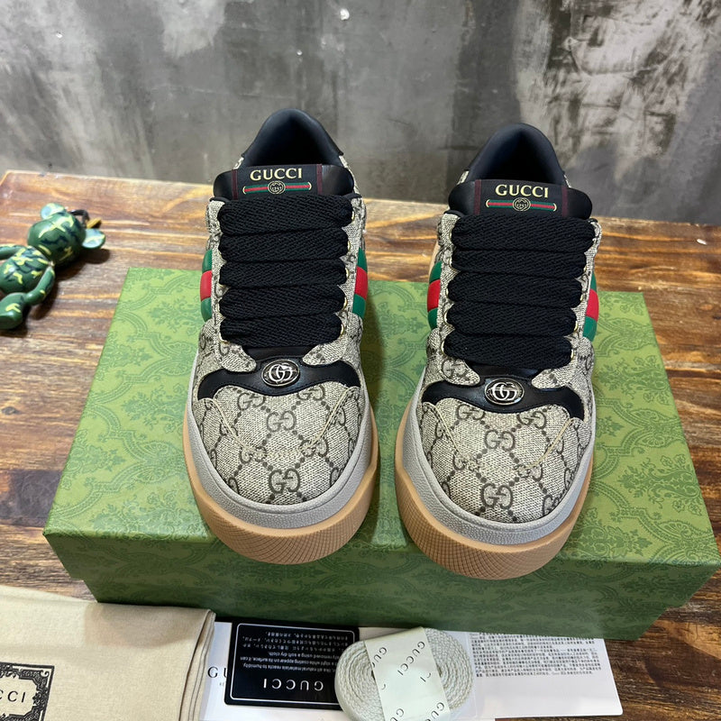 Side profile of Gucci two-tone sneakers sleek tonal finish