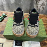 Side profile of Gucci two-tone sneakers sleek tonal finish