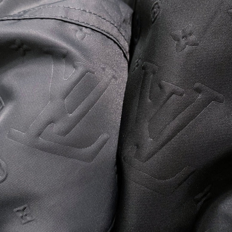 Close-up detail shot of Louis Vuitton luxury clothing with relaxed-fit cut
