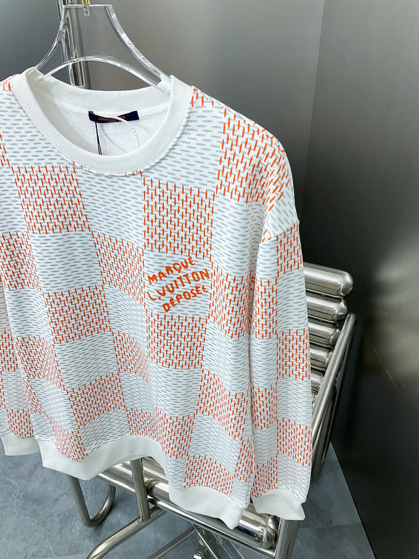Full styled look of Louis Vuitton luxury clothing with label-forward styling