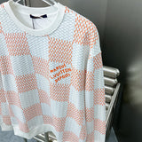 Full styled look of Louis Vuitton luxury clothing with label-forward styling