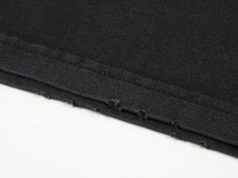 Close-up detail shot of Givenchy luxury clothing with signature branding