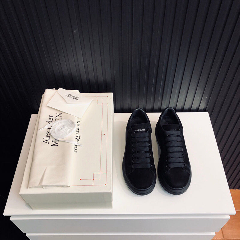 Alexander McQueen tonal black luxury sneakers view 4 classic court silhouette