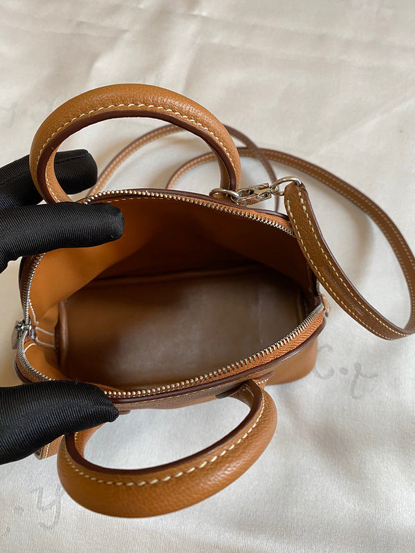Side view of minimalist structured handbag
